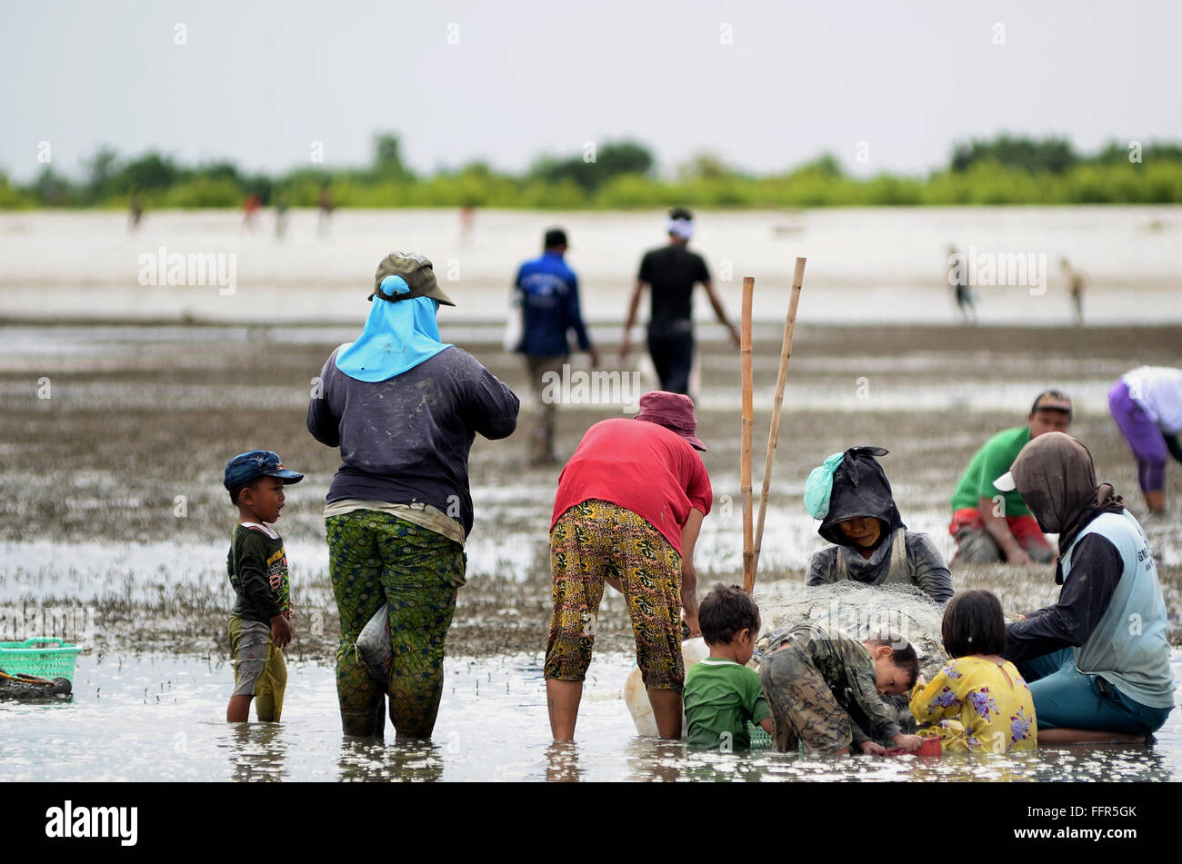 Of people looking for shells on the beach batu bara, North Sumatra ,Indonesia Stock Photo