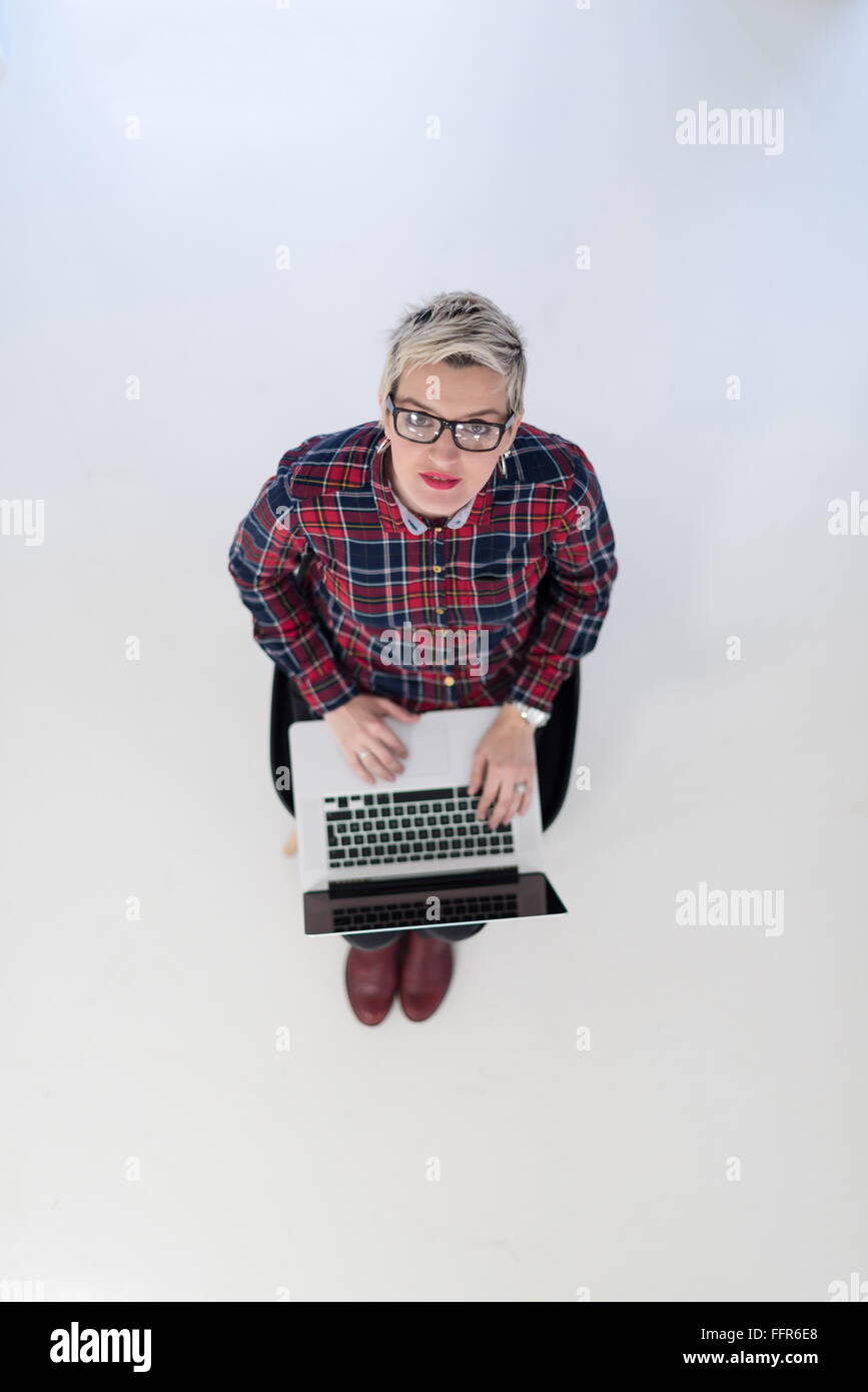 top view of young business woman working on laptop computer in modern ...