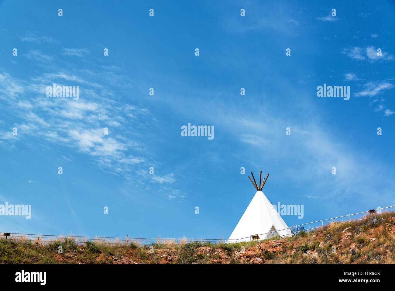 White teepee with a beautiful blue sky near Beulah, Wyoming Stock Photo