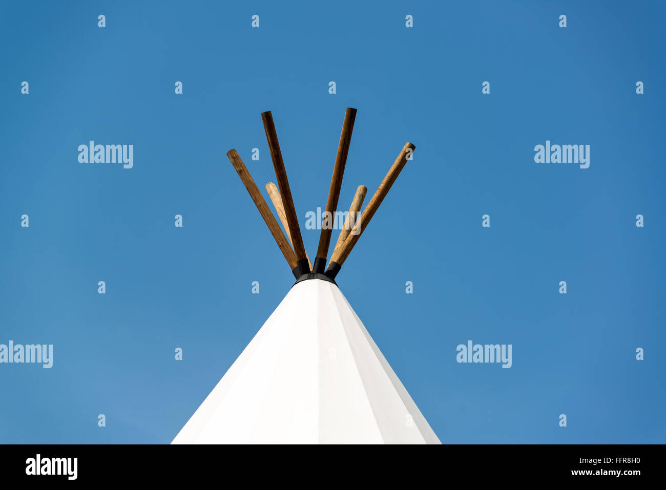 Top of a teepee with a blue sky near Beulah, Wyoming Stock Photo