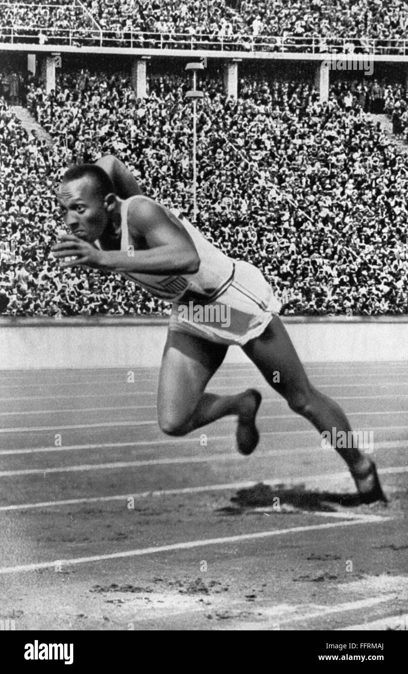 JESSE OWENS (1913-1980). /nAmerican athlete. At the start of his record-breaking 200 meter race at the Olympic Games in Berlin. Photograph, 5 August 1936. Stock Photo