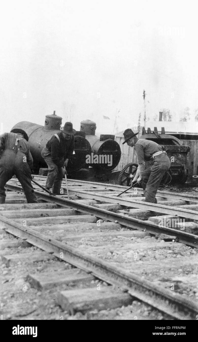 ALASKA RAILROAD WORKERS. /nConstruction workers laying down railroad