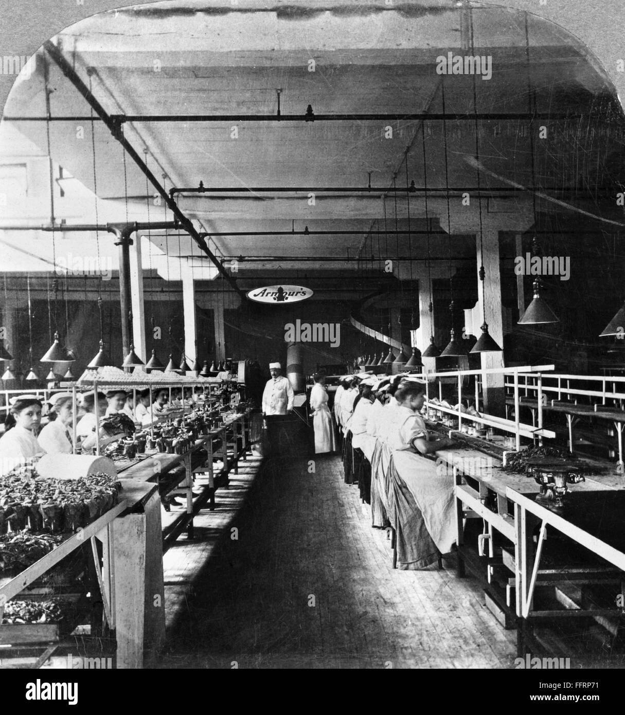 CHICAGO MEATPACKING. /nFactory workers packing sliced bacon in glass
