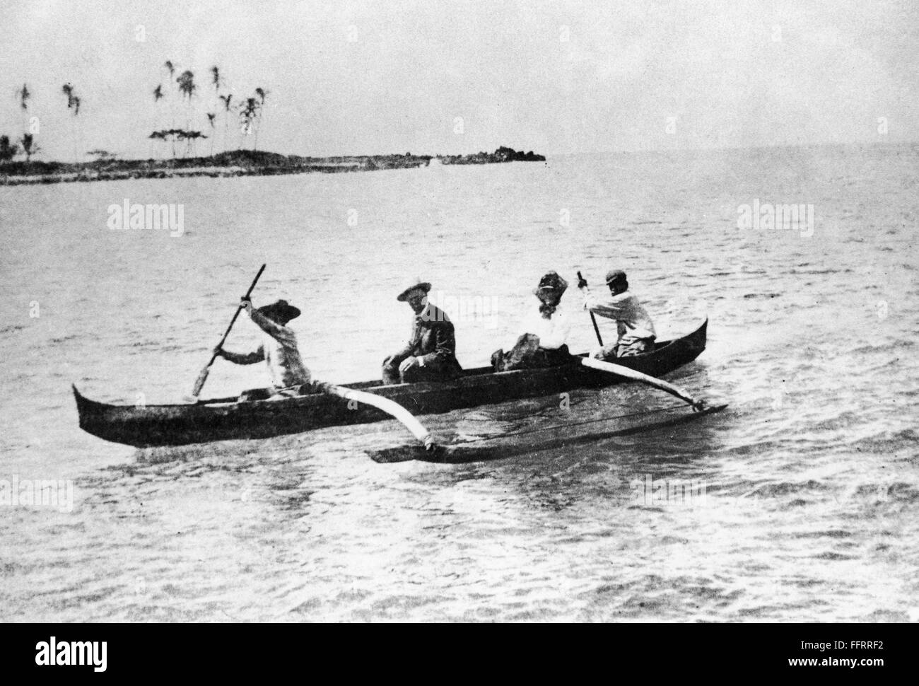 HAWAII OUTRIGGER. /nA man and woman being rowed in an outrigger canoe