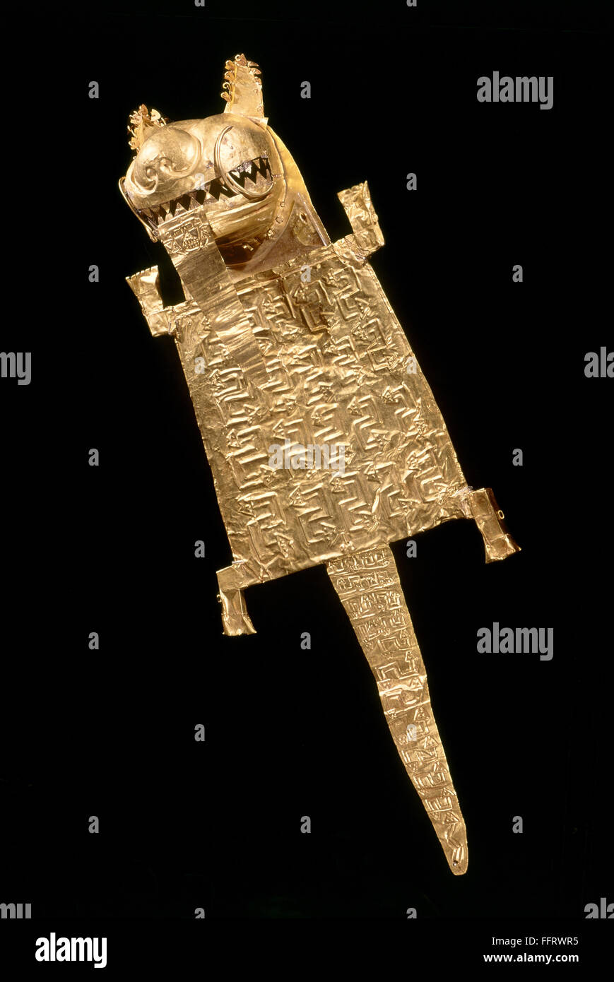 INCAN GOLD ORNAMENT. /nIncan ornament of embossed gold in the shape of a jaguar. Stock Photo