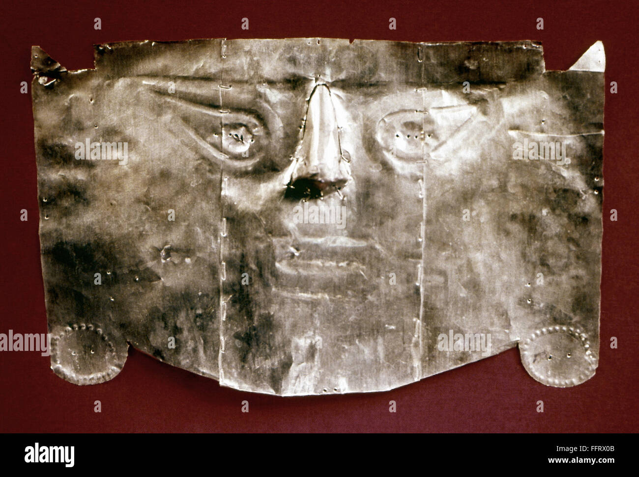 PERU: GOLD MUMMY MASK. /nGold mummy mask created by the Chimu, Moche, or Inca civilization at Lambayeque, Peru. Stock Photo