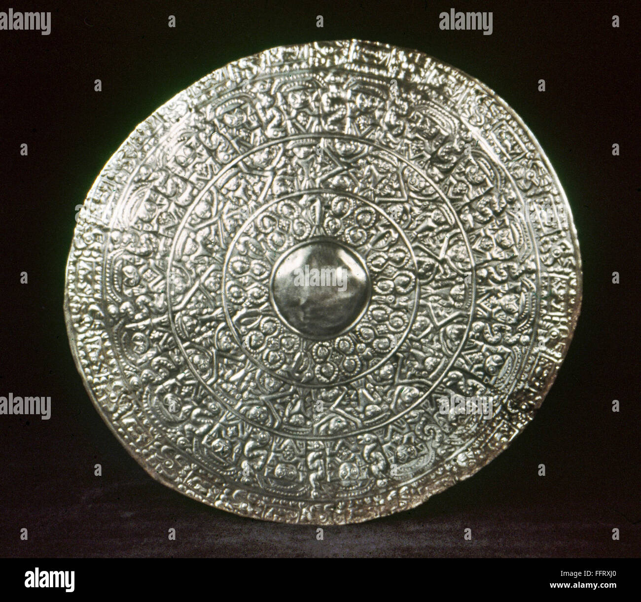 PERU: CHIMU SILVER DISK. /nLarge embossed silver disk made by the Chimu culture of ancient Peru, 13th - 16th century. Stock Photo