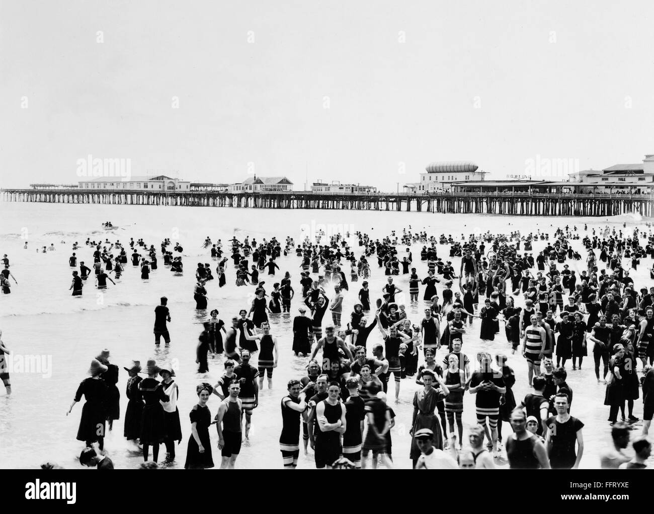 ATLANTIC CITY BEACH. /nA crowd of people standing in the ocean with a