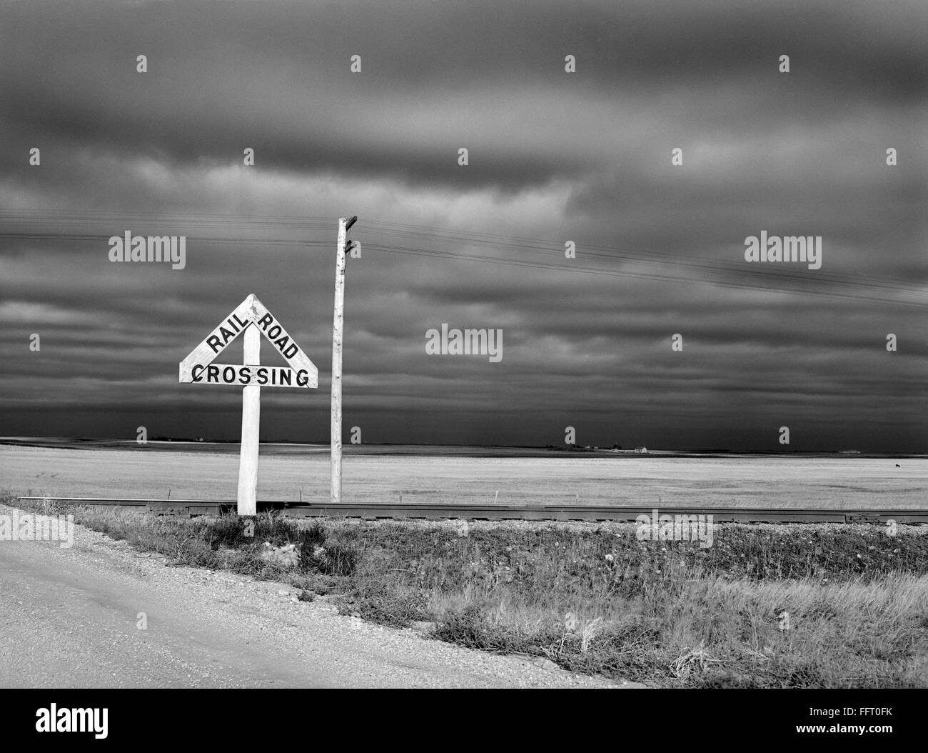NORTH DAKOTA ROAD, 1940. /nRailroad crossing on a rural road in McHenry