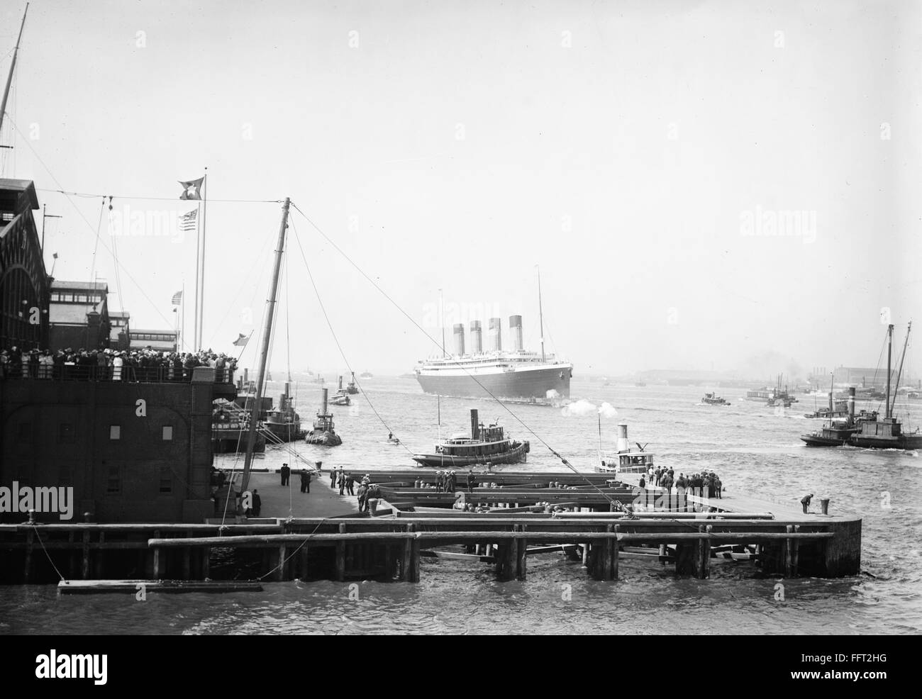 RMS OLYMPIC, 1911. /nThe arrival of the RMS Olympic ocean liner in New York Harbor after her 1911 maiden voyage. The ship was built for the White Star Line, which also included Titanic and Britannic. Unlike her sisters, Olympic served a long and illustrio Stock Photo