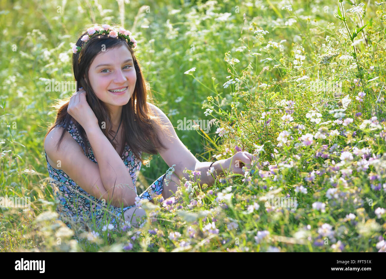 Teen girl in a summer field Stock Photo