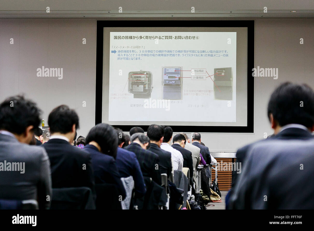 Attendants listen the explanation of Ryuichi Inagaki, Acting chairman of the Electricity Market Surveillance Commission, about the liberalization of the Japanese electricity retail market that will begin to take effect in April, at the Ministry of Economy, Trade and Industry building on February 17, 2016, Tokyo, Japan. The liberalization of the power industry will mark the end of a decades-long monopoly by Japanese regional power companies. In 2015 over 200 companies applied for registration as power retailers including the convenience store Lawson Inc., and also the major mobile phone operato Stock Photo