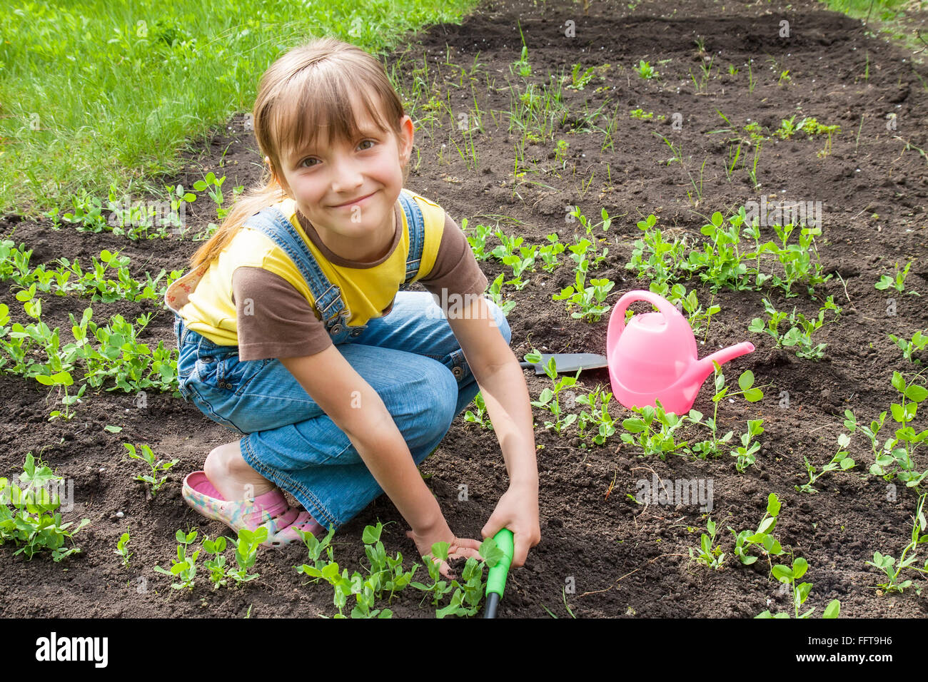 little girl in garden Stock Photo Alamy