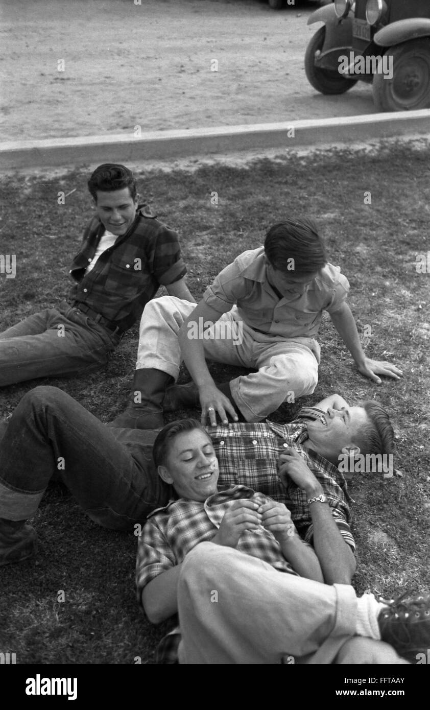 COUNTY FAIR, 1942. /nTeenage boys lounging on the grass at the Imperial