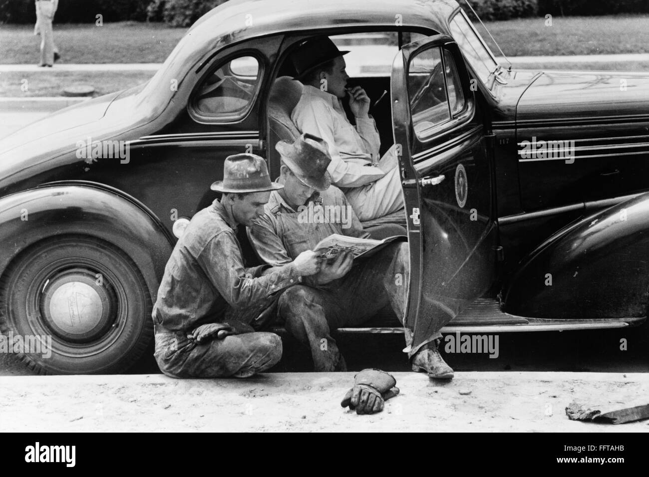 TEXAS OIL WORKERS, 1939. /nOil field workers reading the newspaper