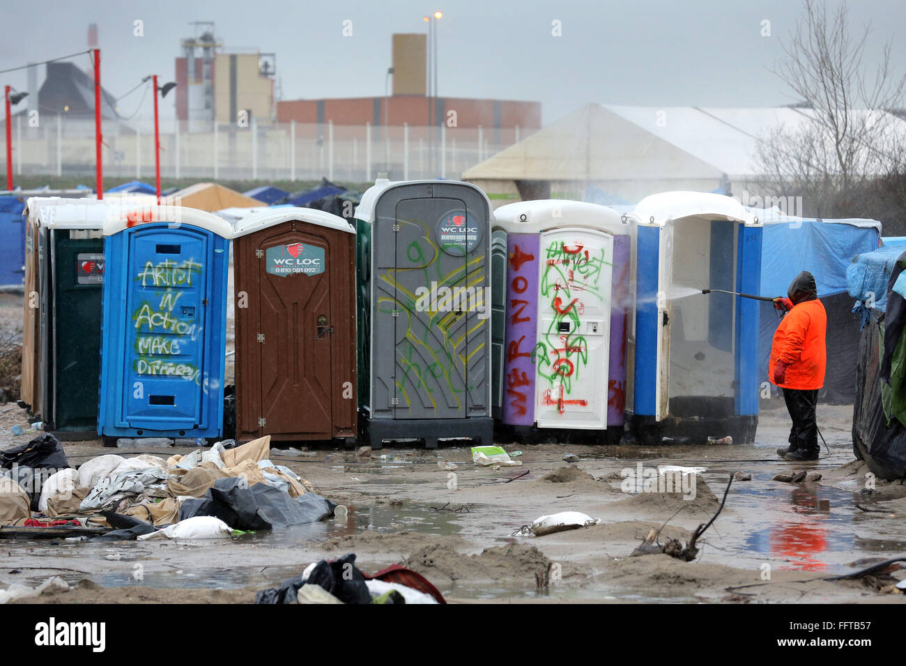The Jungle, Calais, France. February 2016. Mobile toilets for refugees next to the tented refugee camp known as 'the jungle' Stock Photo