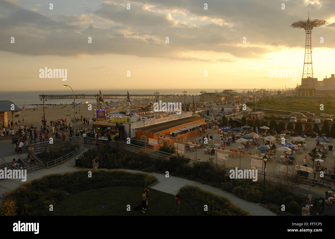 CONEY ISLAND: SUNSET. /nView of the beach and outdoor bar at Coney ...