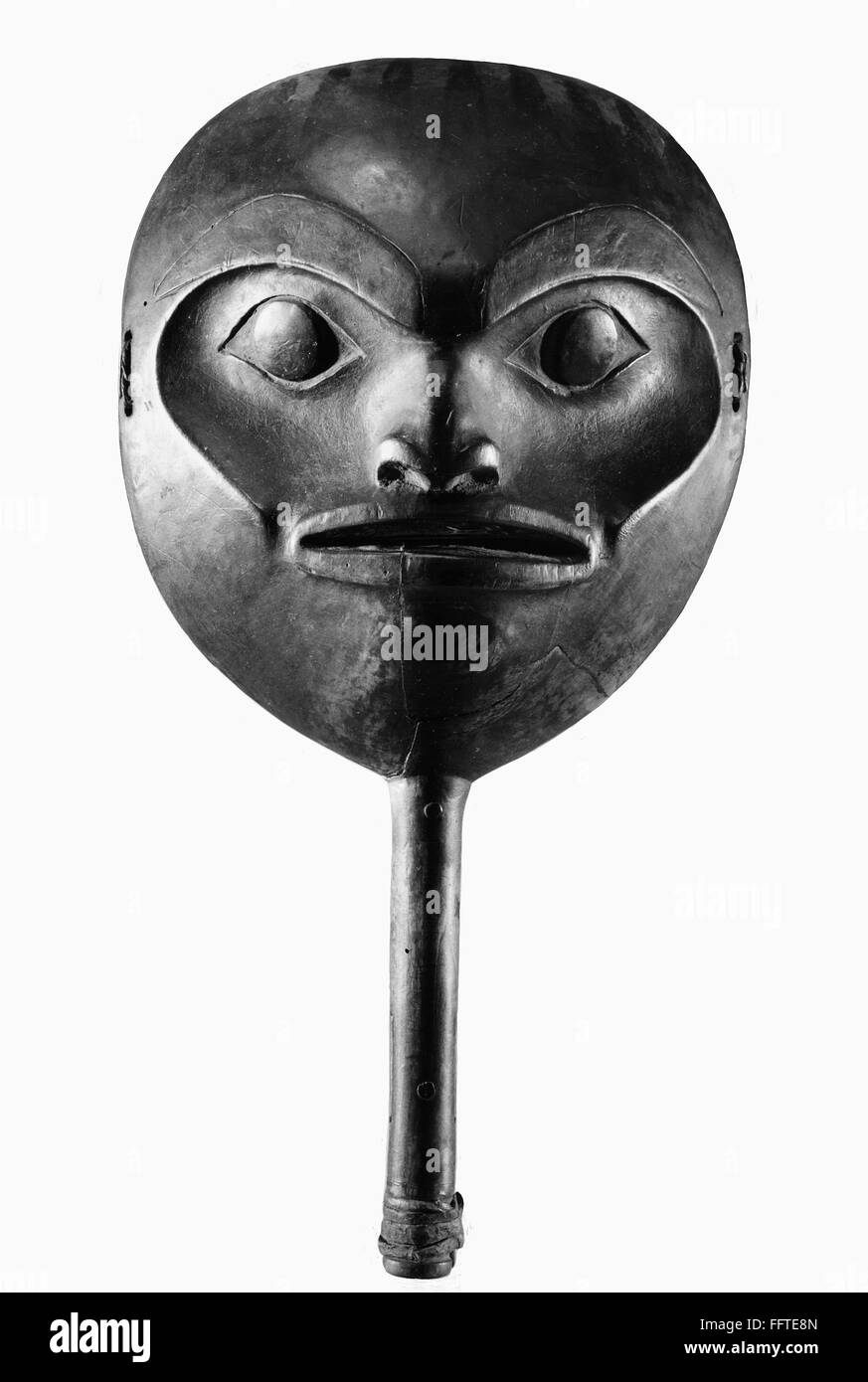 TSIMSHIAN RATTLE. /nWood and leather rattle in the shape of a face