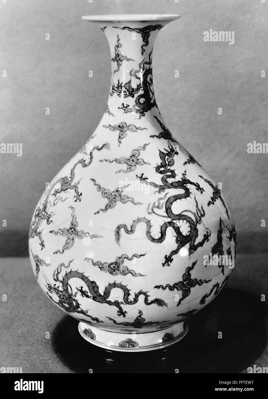 CHINA PORCELAIN VASE. /nGlazed white porcelain vase with dragon design