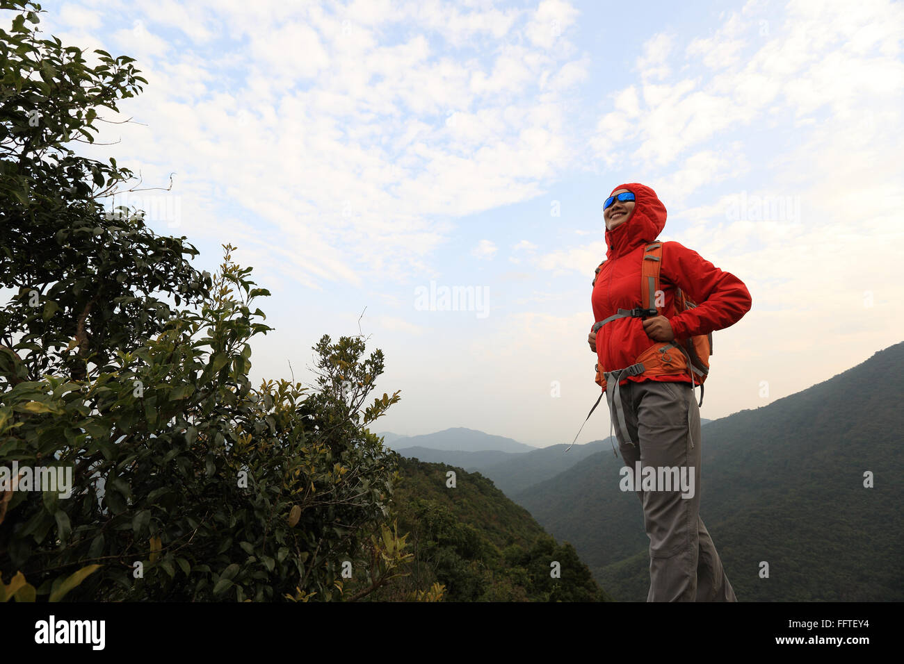 young woman hiker hiking at mountain peak Stock Photo - Alamy