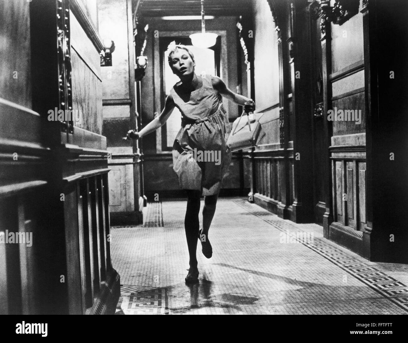 ROSEMARY'S BABY, 1968. /nMia Farrow, as Rosemary, running down a hallway at the Dakota on