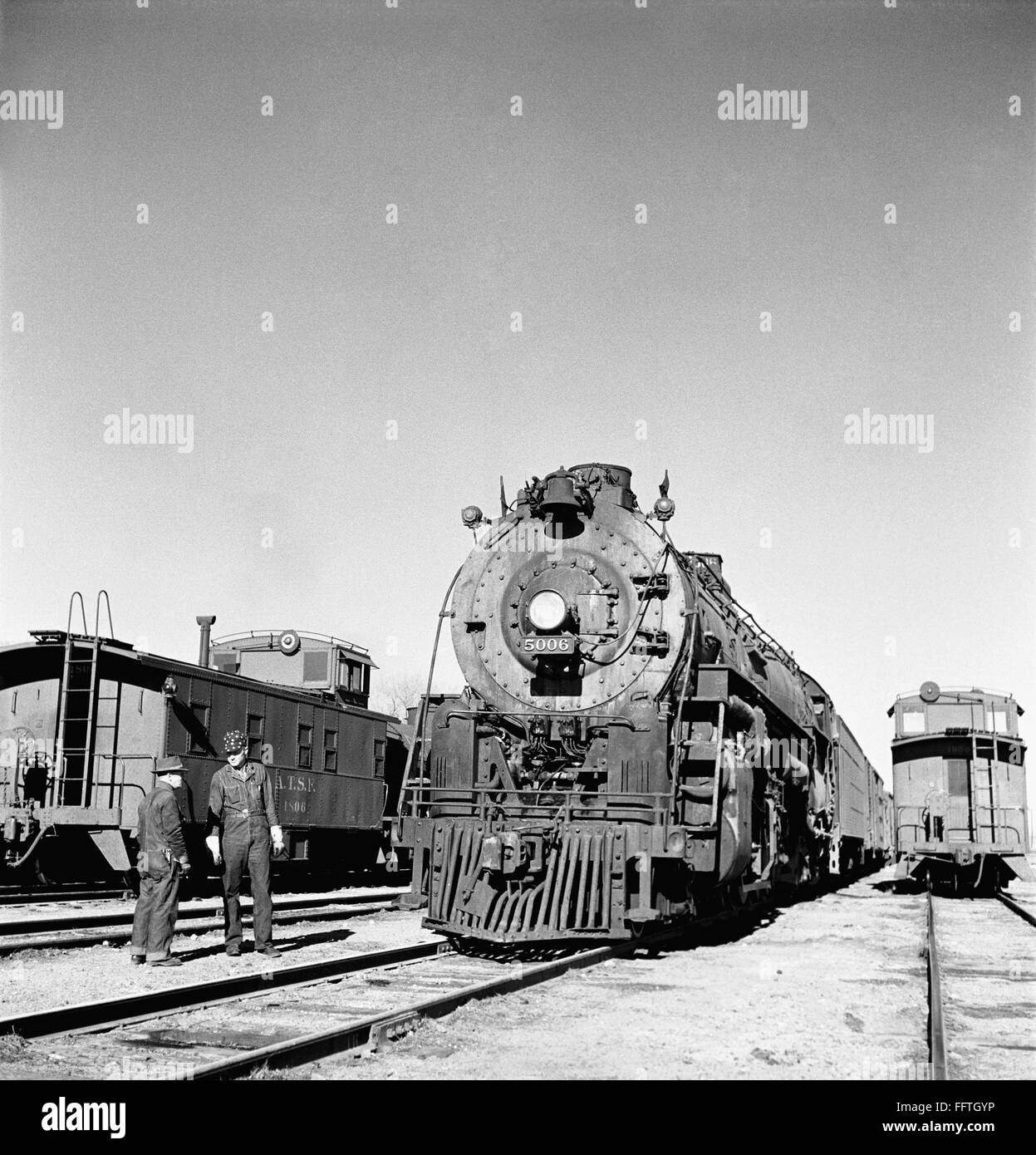 RAILROAD YARD, 1943. /nEasternbound train about to leave the Atchison ...