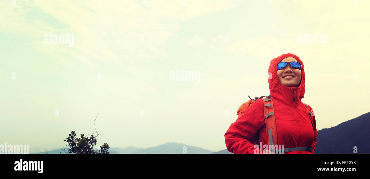young woman hiker hiking at mountain peak Stock Photo - Alamy