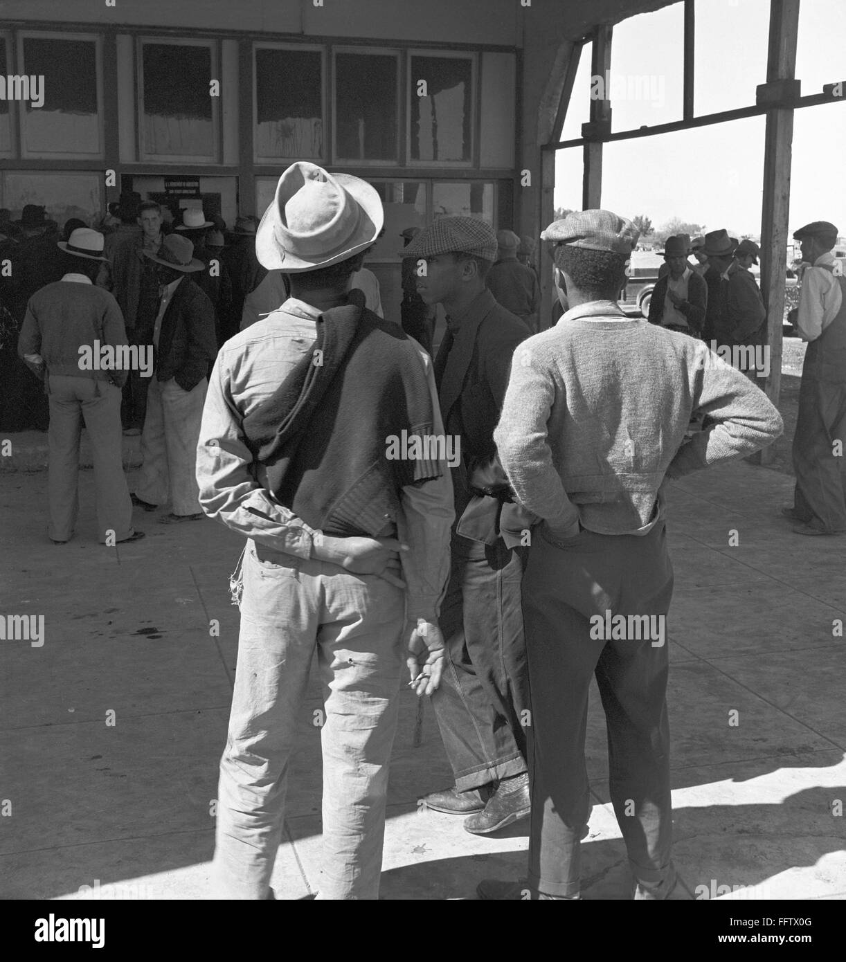 FARM RELIEF, 1939. /nMigrant farmers standing outside the Farm Security
