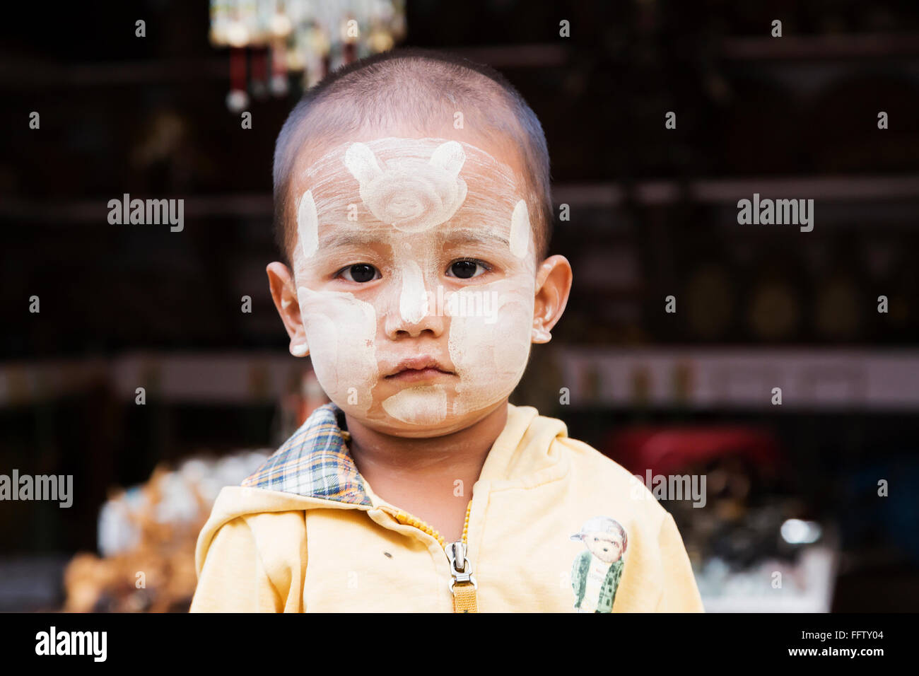 BAGAN, BURMA - 15 March 2015. Portrait of a Burmese boy with tanaka face painting. The use of Tanaka is distinctly Burmese. Baga Stock Photo