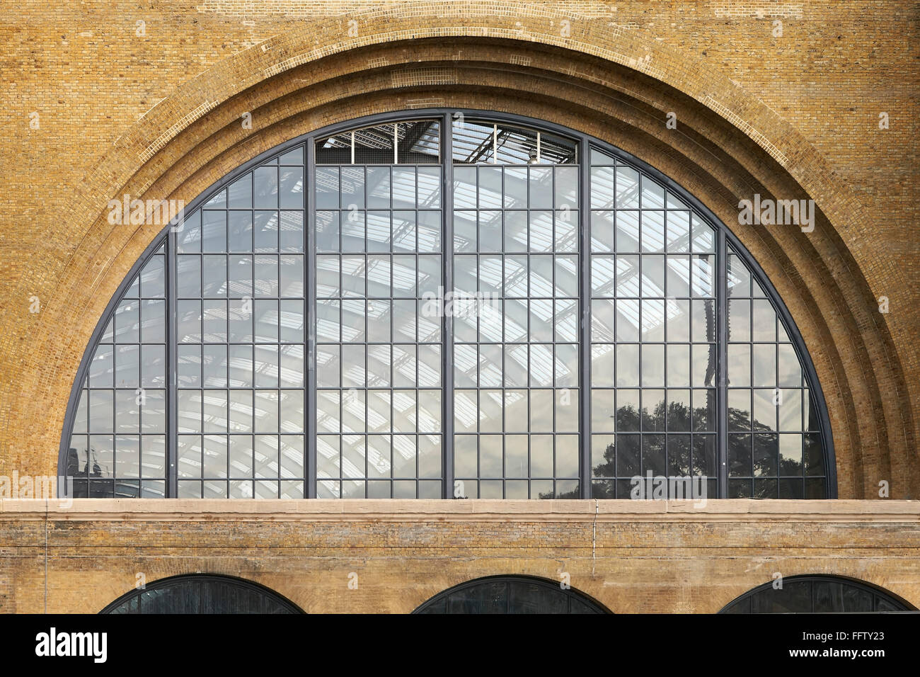 Detailed elevation with arched window glazing. King's Cross Square, London, United Kingdom. Architect: Stanton Williams Architec Stock Photo