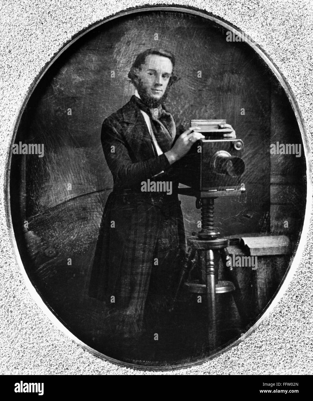 DAGUERREOTYPIST, 1850s. /nUnidentified photographer with an American daguerreotype camrera. Daguerreotype, American, 1850s. Stock Photo