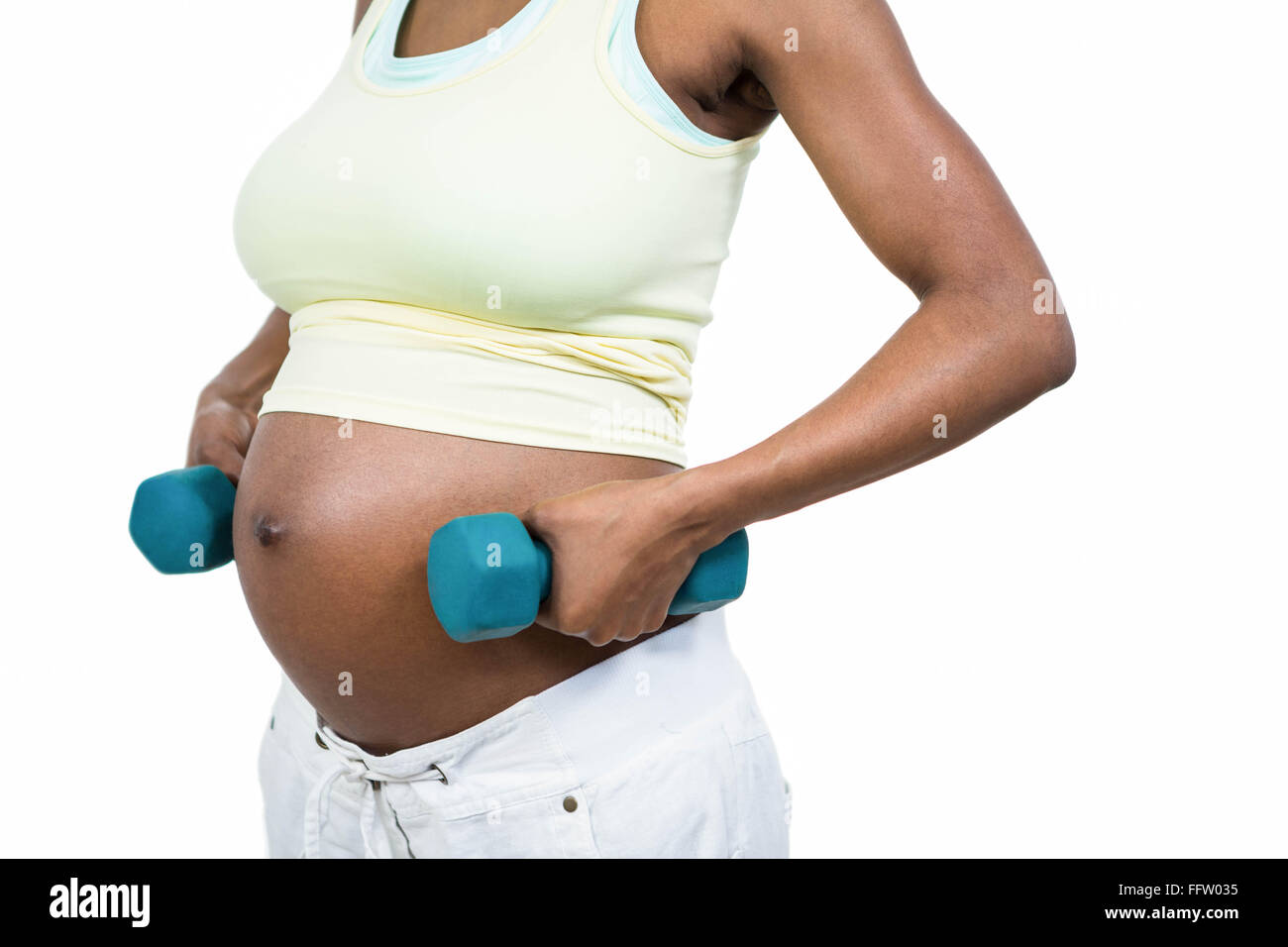 View of Pregnant woman lifting dumbbell Stock Photo - Alamy