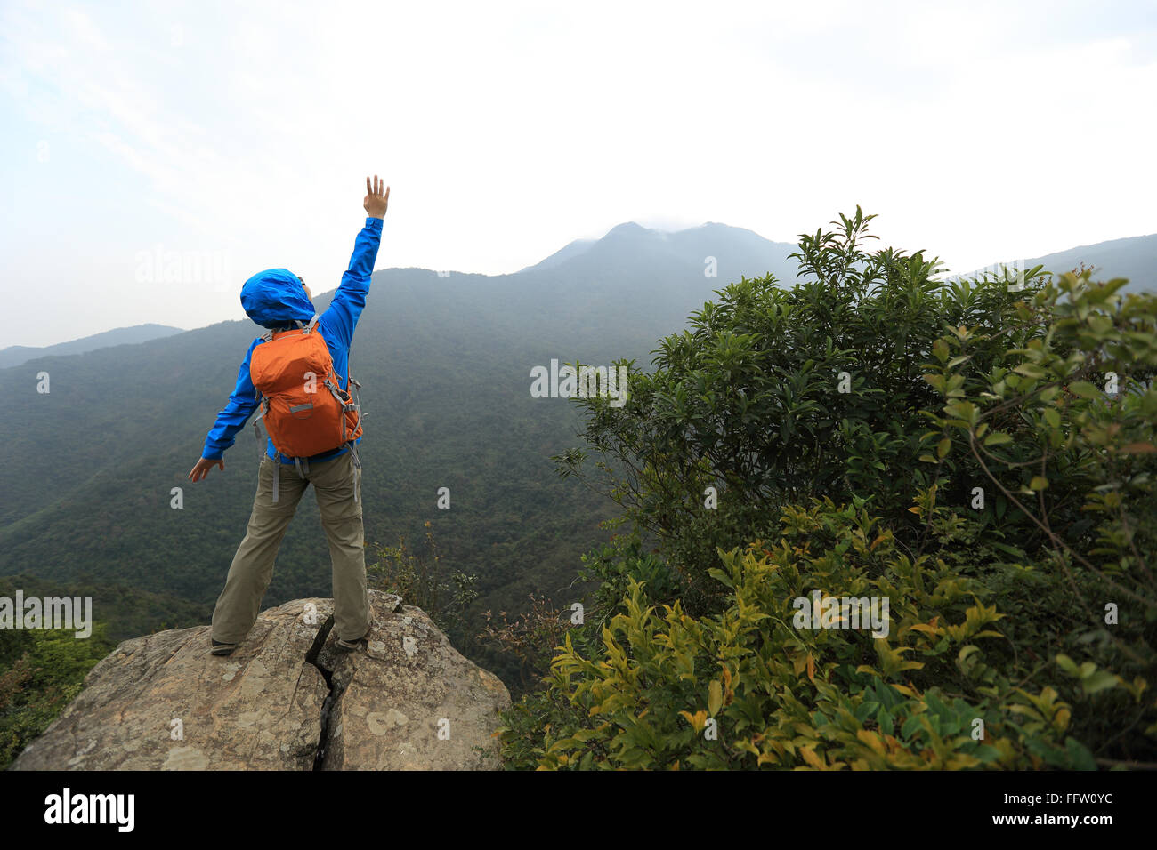 successful woman hiker at mountain peak Stock Photo - Alamy