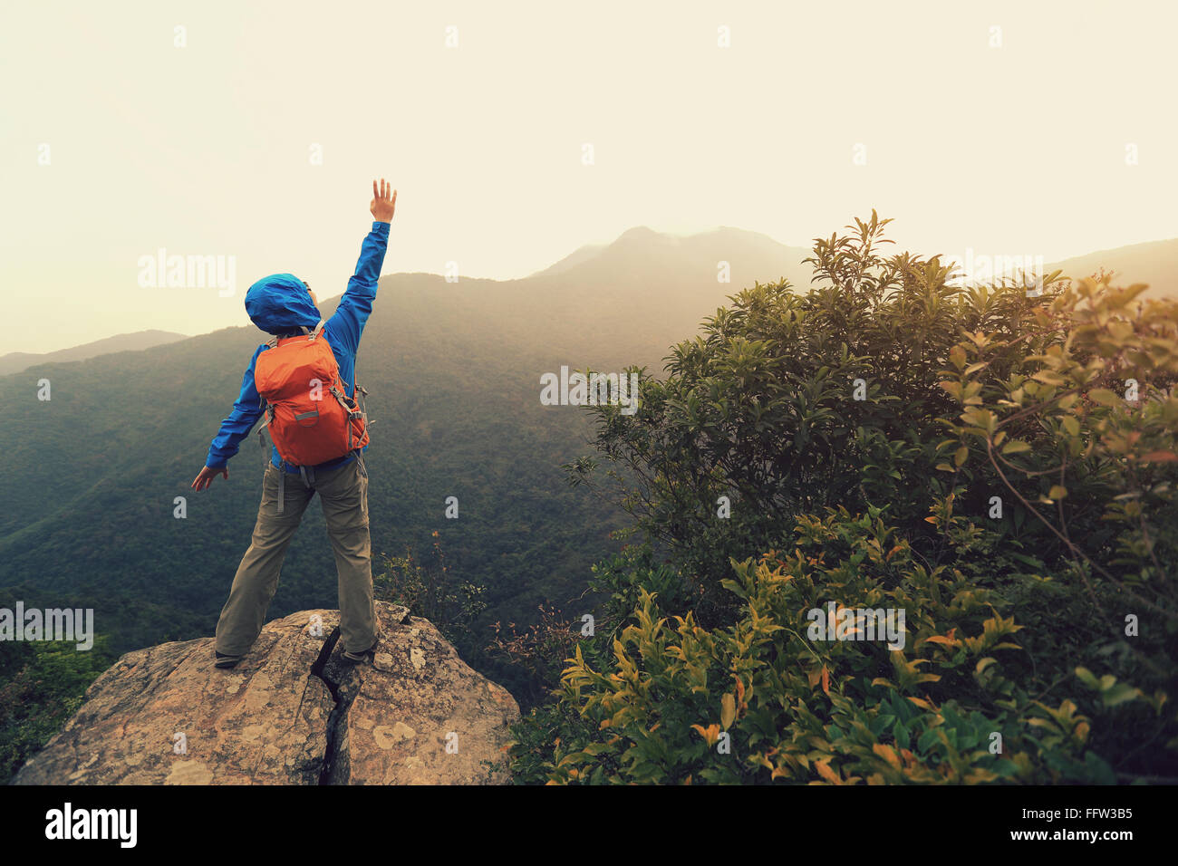 successful woman hiker at mountain peak Stock Photo - Alamy
