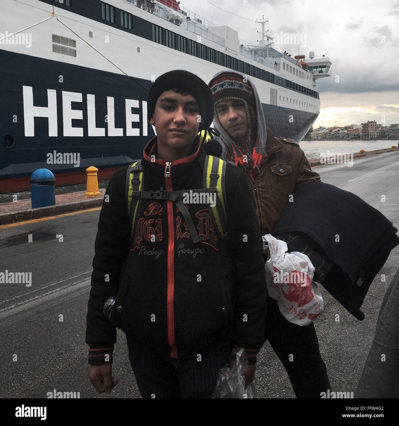 Migrants on Chios Island -  03/01/2016  -  Greece / Cyclades (the) / Chios island  -  Young refugees in front of the ship, that  Stock Photo