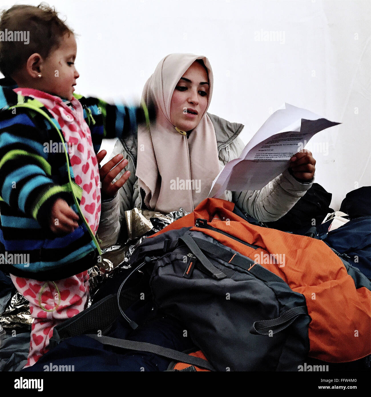 Migrants on Chios Island -  03/01/2016  -  Greece / Cyclades (the) / Chios island  -  Syrian woman reads the letter that was in  Stock Photo
