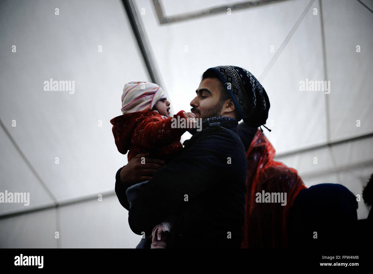 Migrants on Chios Island -  03/01/2016  -  Greece / Cyclades (the) / Chios island  -  Young father with crying baby in the UNHCR Stock Photo