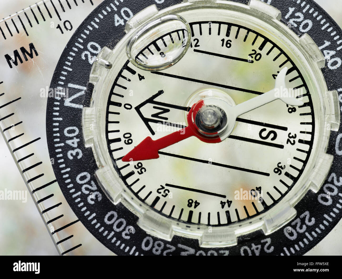 Close Up of a well used Compass Face With Shallow Depth Of Field Stock Photo