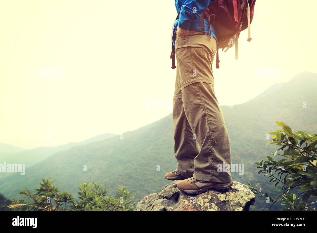 young woman hiker hiking at mountain peak Stock Photo - Alamy
