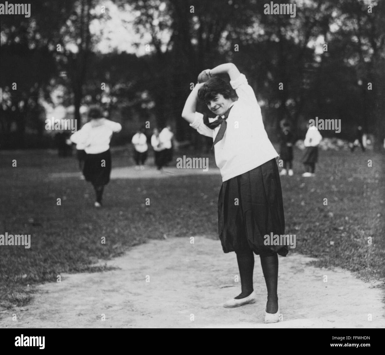 SOFTBALL GAME nA Woman On The Pitcher s Mound Preparing To Throw The Ball During A Softball 