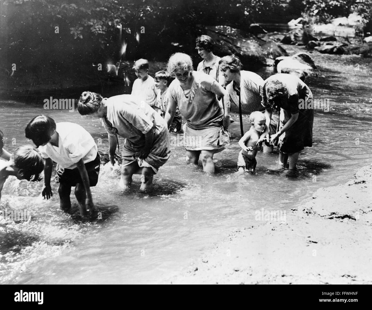 ROCK CREEK: WADING. /nAdults and children wading in Rock Creek Park, a ...