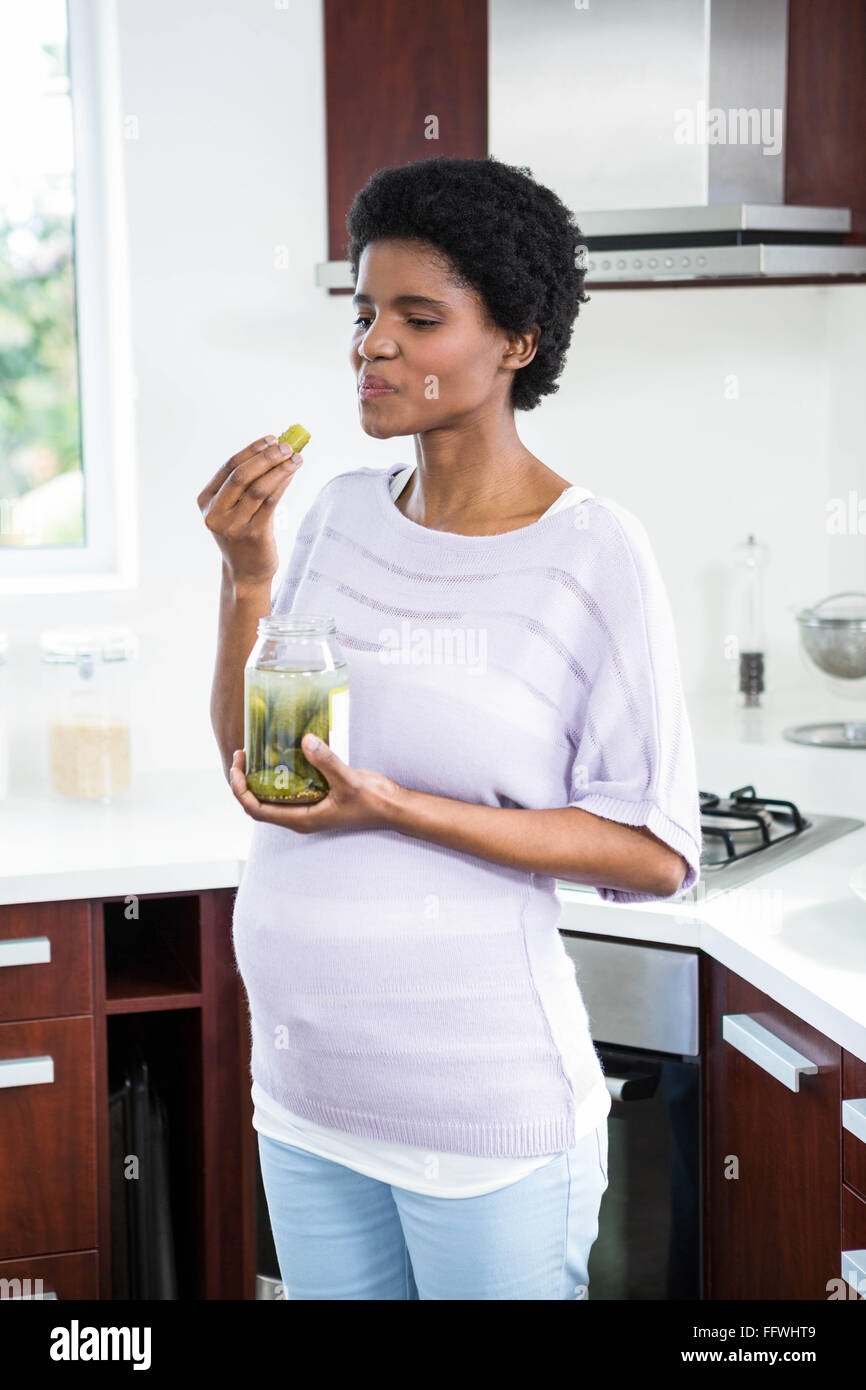Pregnant woman eating pickles Stock Photo Alamy