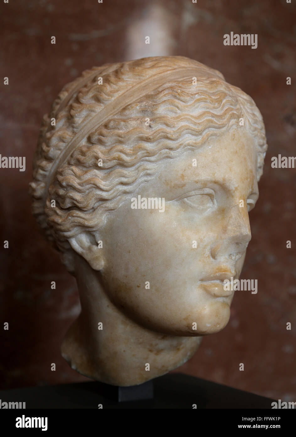 Female head of the Aphrodite of Cnidus type, Roman imperial era. Provenance: unknown. Copy of Praxiteles. Louvre Museum. Paris. Stock Photo