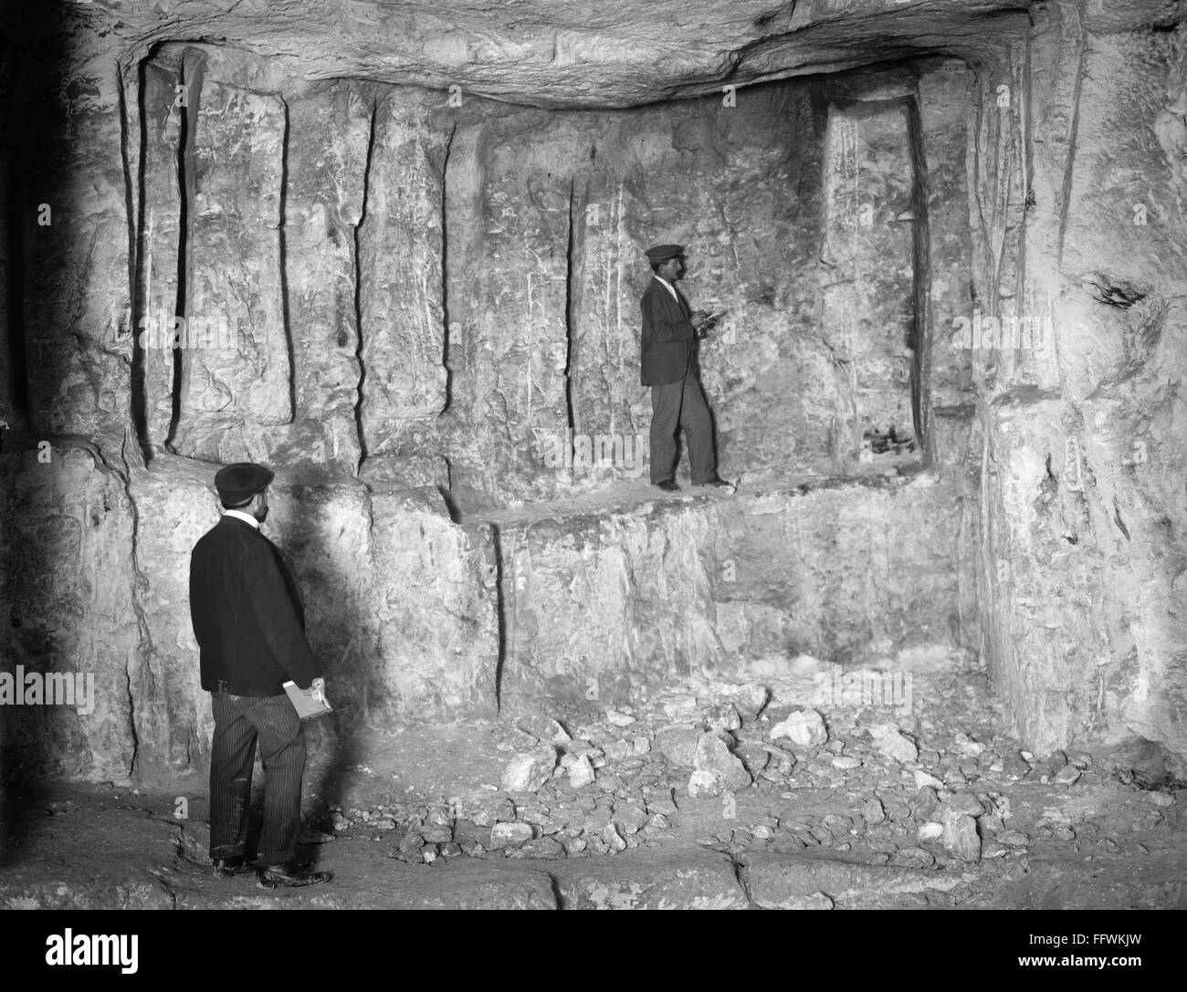 JERUSALEM ZEDEKIAH'S CAVE. /nTwo men documenting Zedekiah's Cave, also