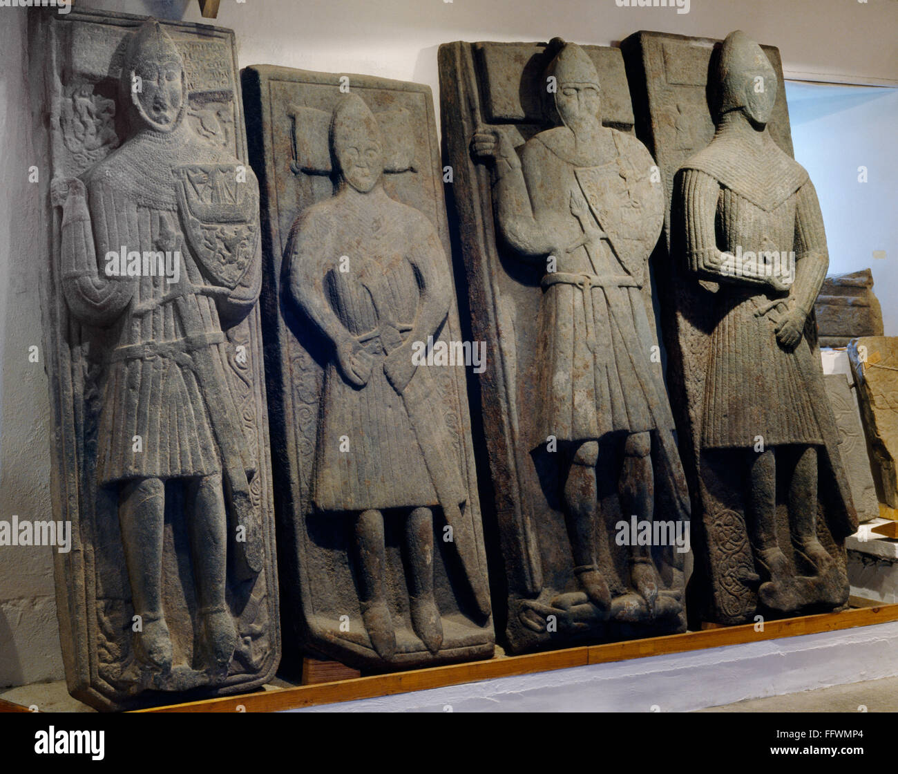 Four West Highland chieftain's  grave slabs, including MacKinnon's Stone and The Lachlan Stone. Iona Abbey museum, Iona, Inner Hebrides, Scotland, UK Stock Photo