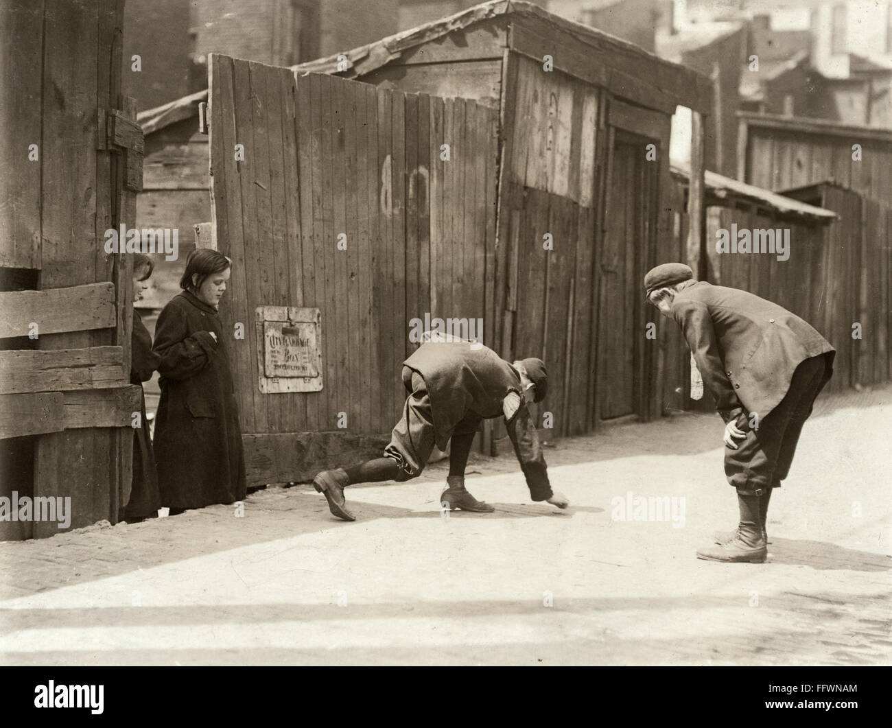 BOYS SHOOTING CRAPS, 1910. /nStreet gang boys playing with dice while