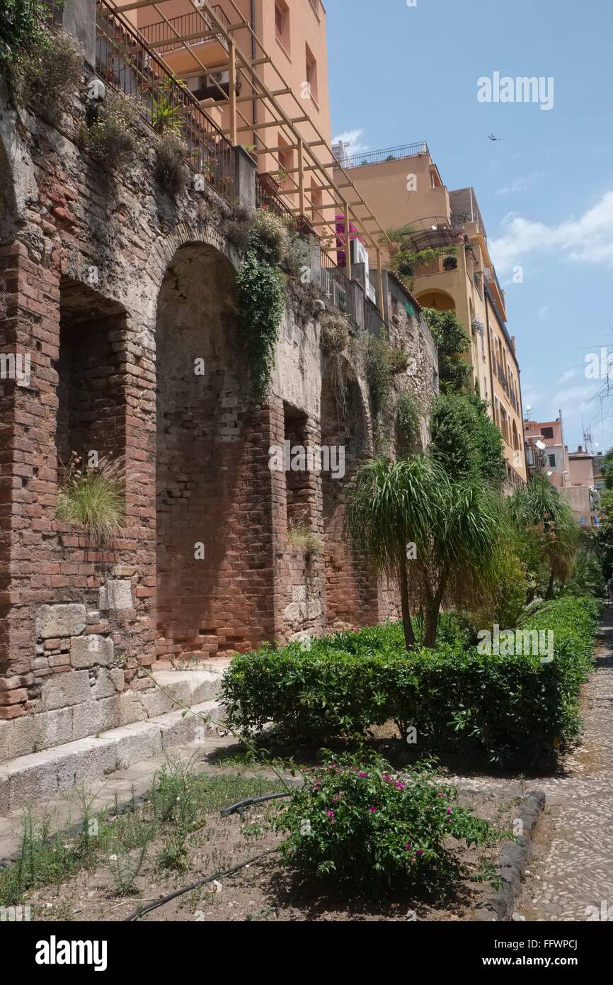 Ancient Roman remains, thought to be Cisterns form foundations for later residential buildings in Taormina Stock Photo