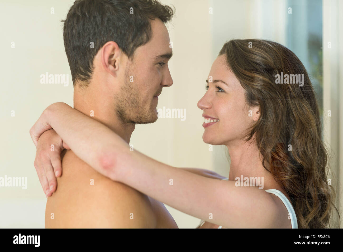 Romantic couple embracing in bathroom Stock Photo - Alamy
