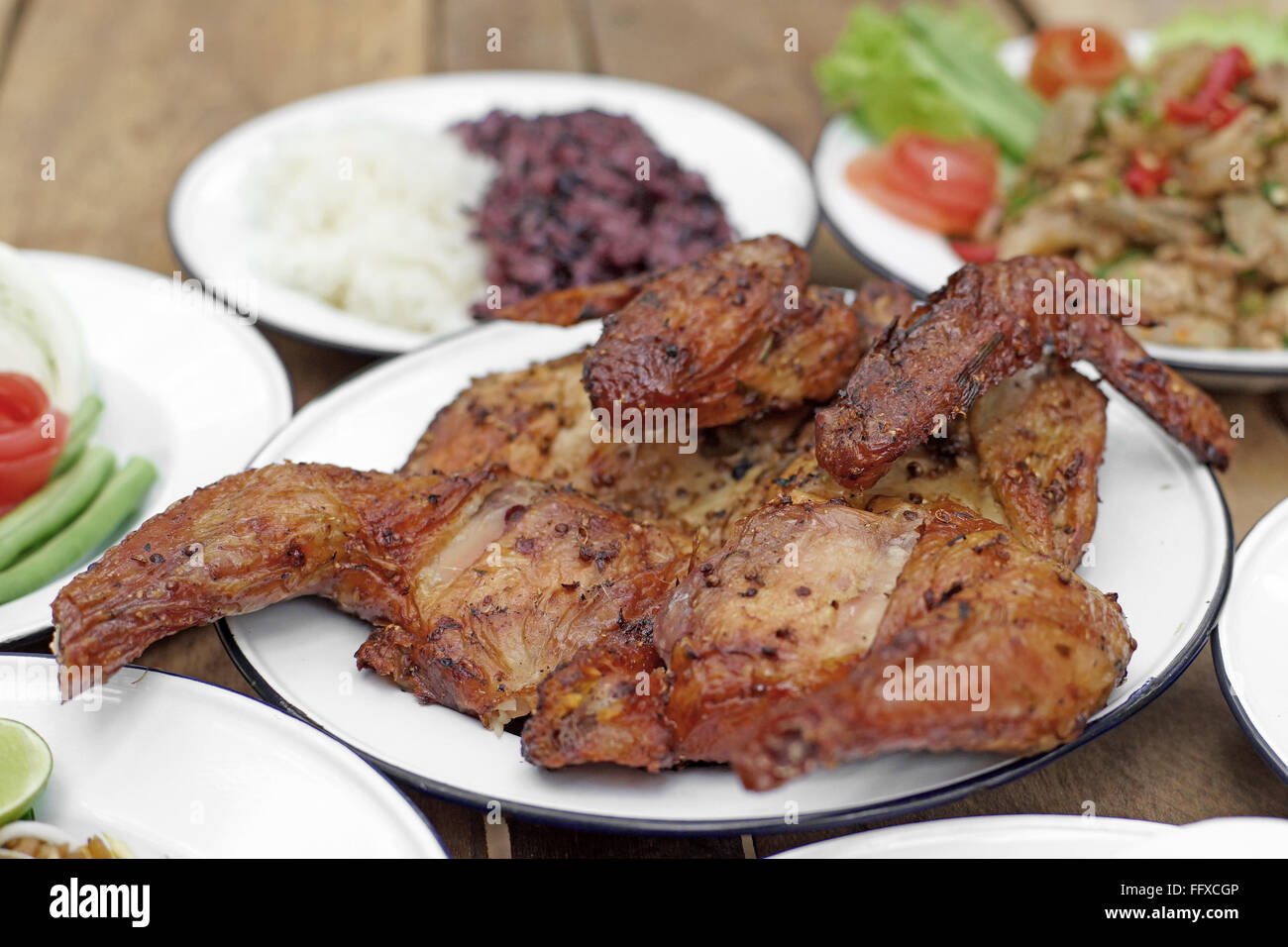 grilled chicken with sticky rice on wooden desk Stock Photo