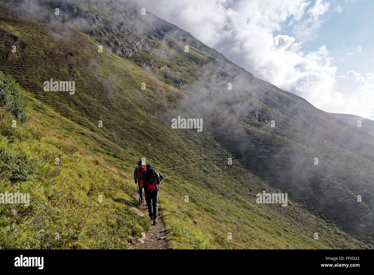 People hiking in Austrian Alps Stock Photo